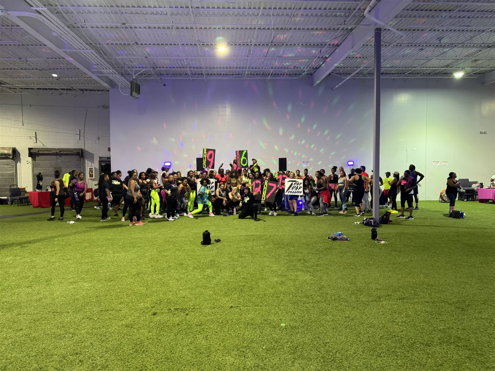 Full Trap Boxing Atlanta event crowd with disco lights