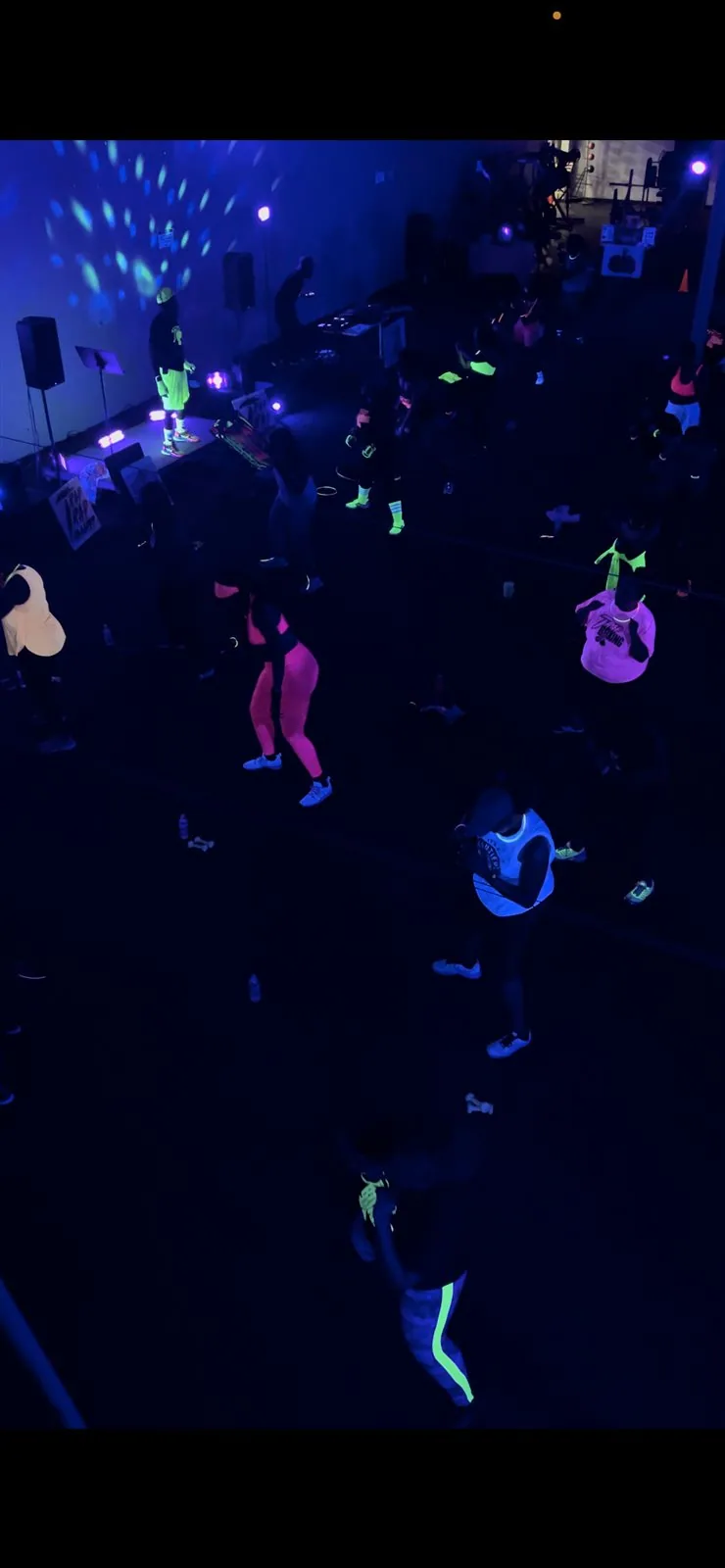 Overhead view of Trap Boxing Atlanta participants under UV lights